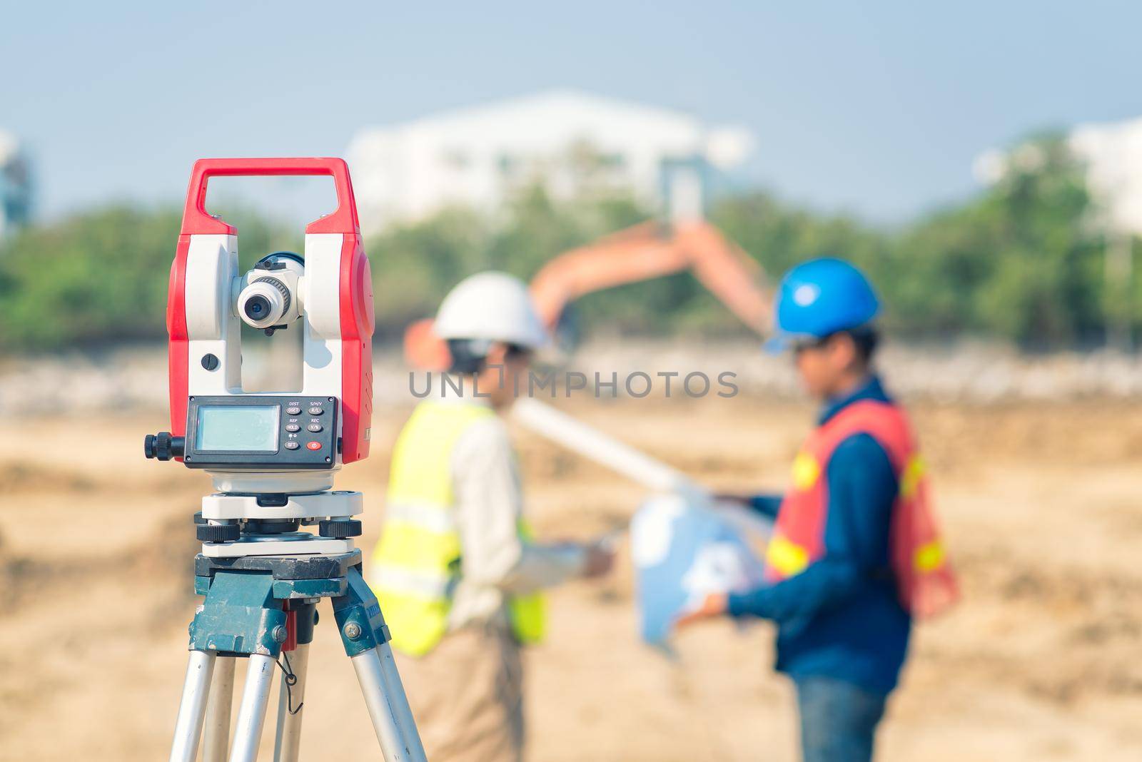 Asian construction engineer checking construction drawing for new Infrastructure project. photo concept for engineering work.