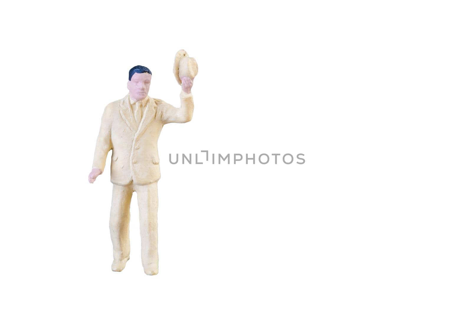 Close up of Miniature people isolated with clipping path on white background.