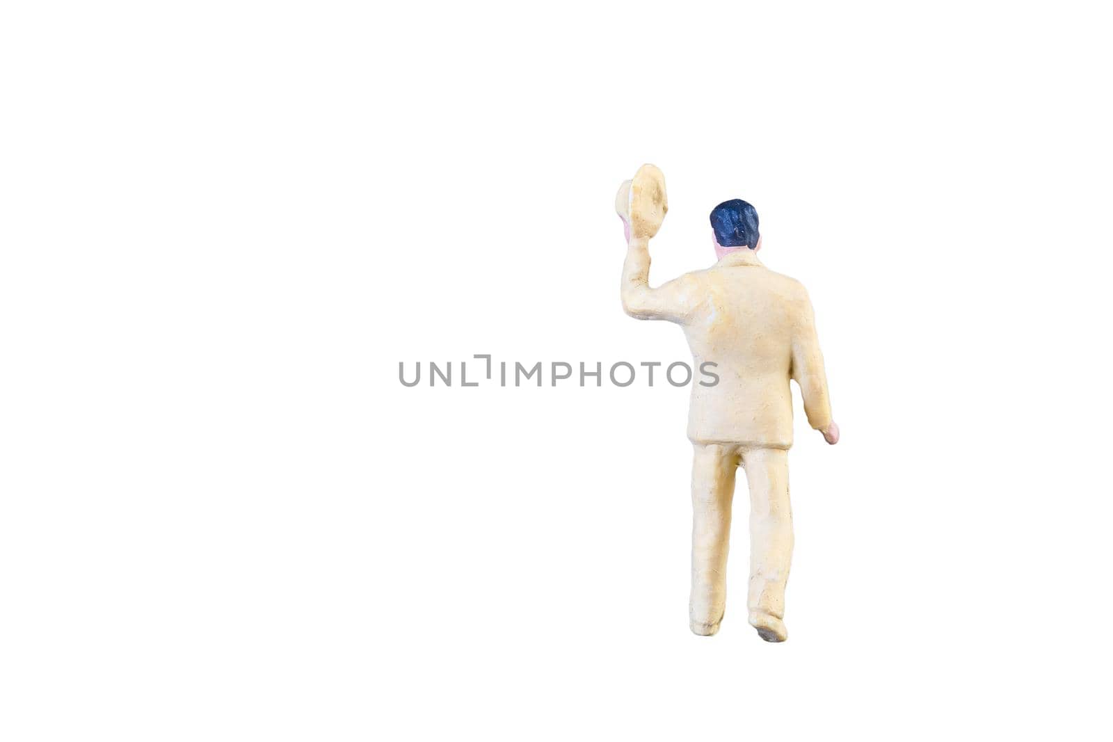 Close up of Miniature people isolated with clipping path on white background.