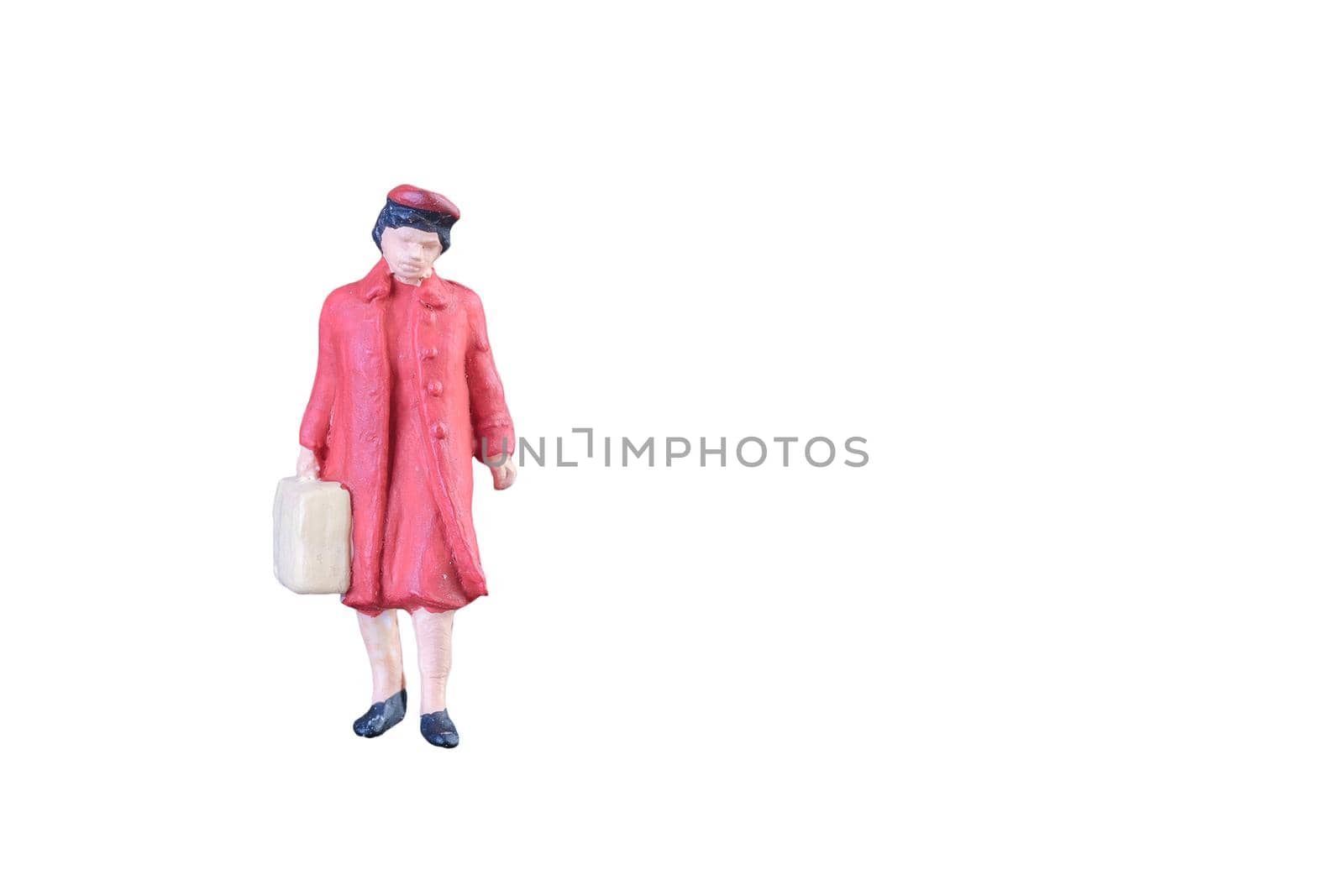 Close up of Miniature people isolated with clipping path on white background.