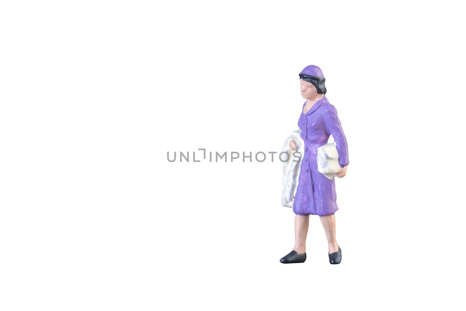 Close up of Miniature people isolated with clipping path on white background.Elegant Design with copy space for placement your text, mock up for business and travel concept.