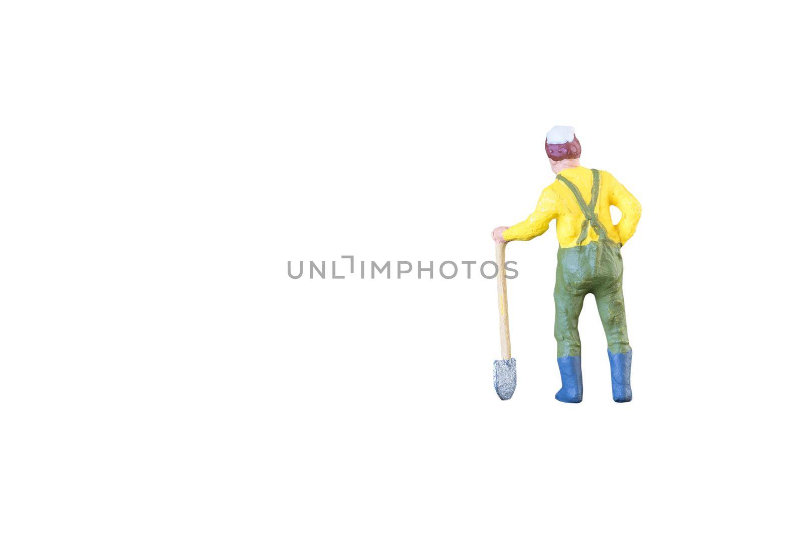 Close up of Miniature farmer people isolated with clipping path on white background . Elegant Design with copy space for placement your text, mock up for farmer and gradening concept by Nuamfolio