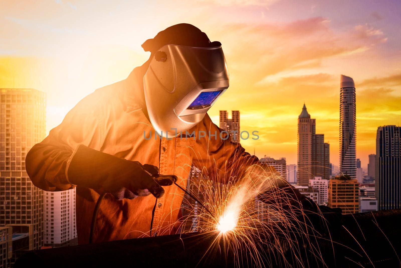 Industrial worker welding steel structure for infrastructure building project. photo concept for Construction industry and engineering work.