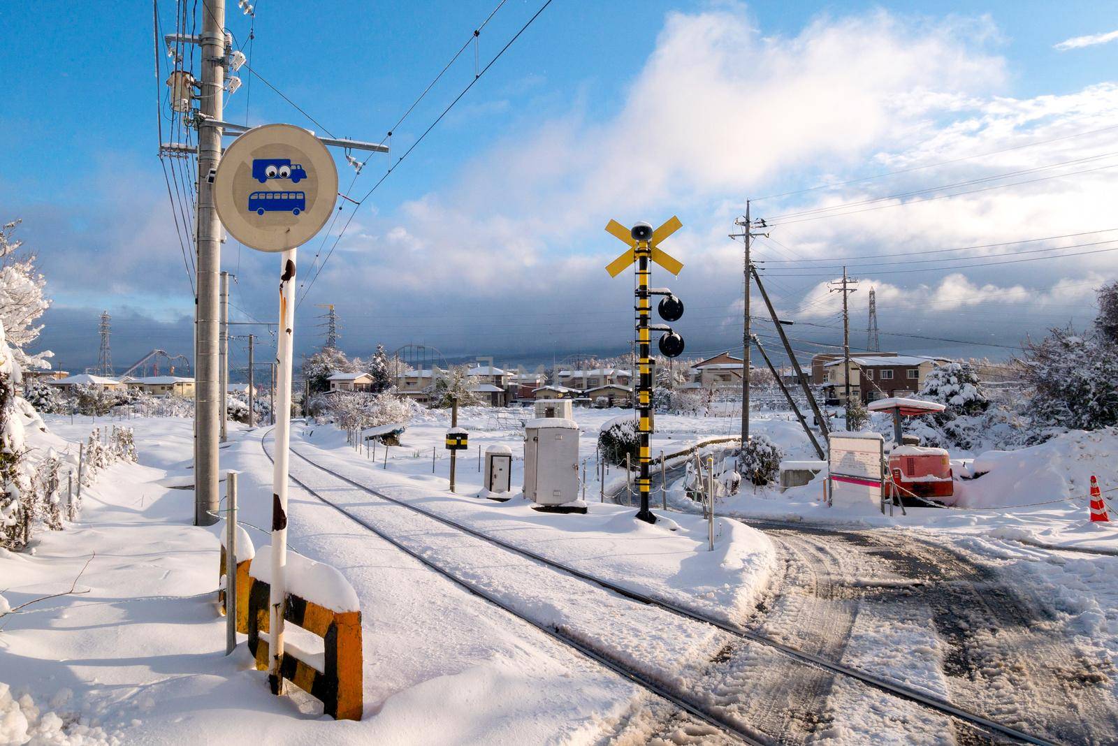 Railway track for local train with white snow fall in winter season,Japan