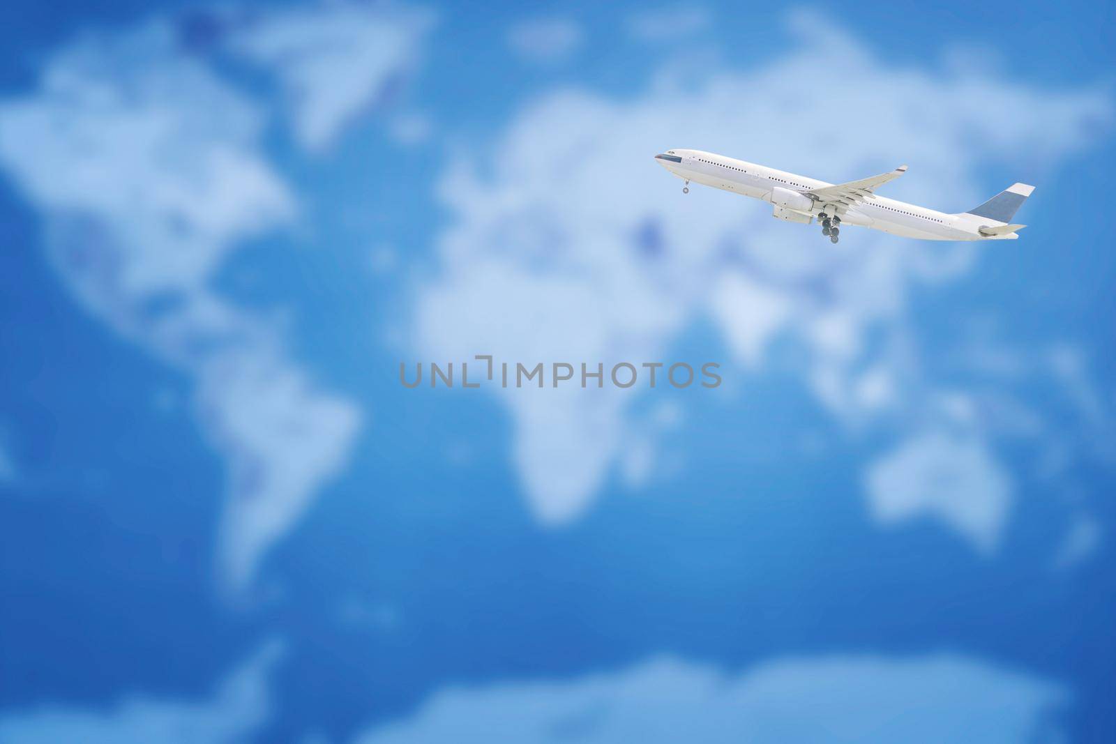 Commercial airplane flying over world map. Elegant Design with copy space for business transportation and travel concept. by Nuamfolio