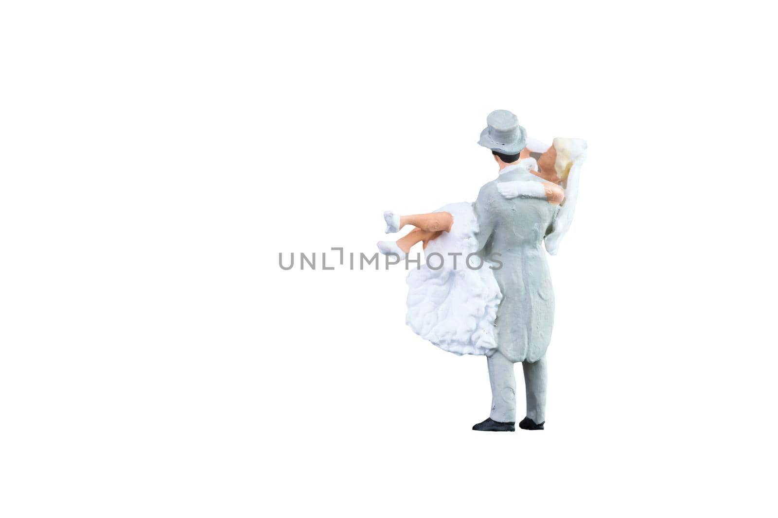 Close up of Miniature people wedding bride and groom couple isolated with clipping path on white background.Elegant Design with copy space for placement your text, mock up for love and wedding concept