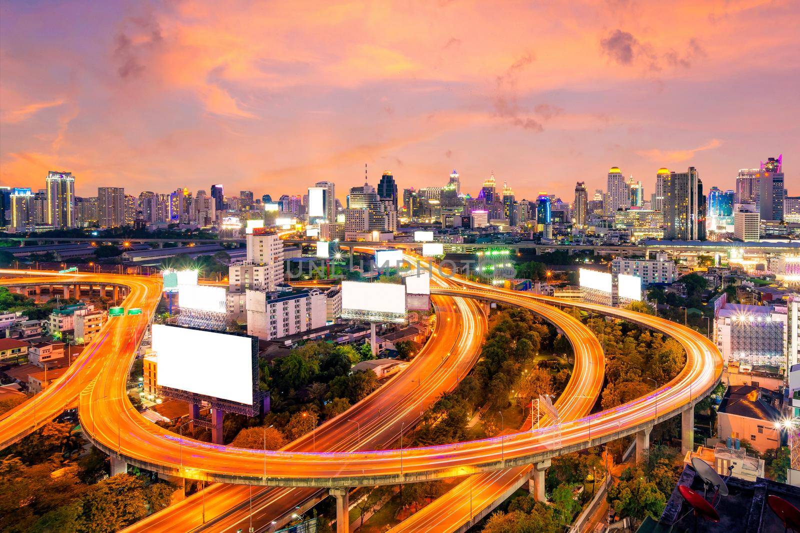 Cityscape view of expressway and modern building in the centre of Bangkok,Thailand. Expressway is the infrastructure for transportation in big city. by Nuamfolio