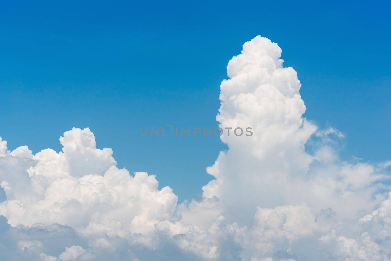 Nature white cloud on blue sky background in daytime, photo of nature cloud for freedom and nature concept by Nuamfolio