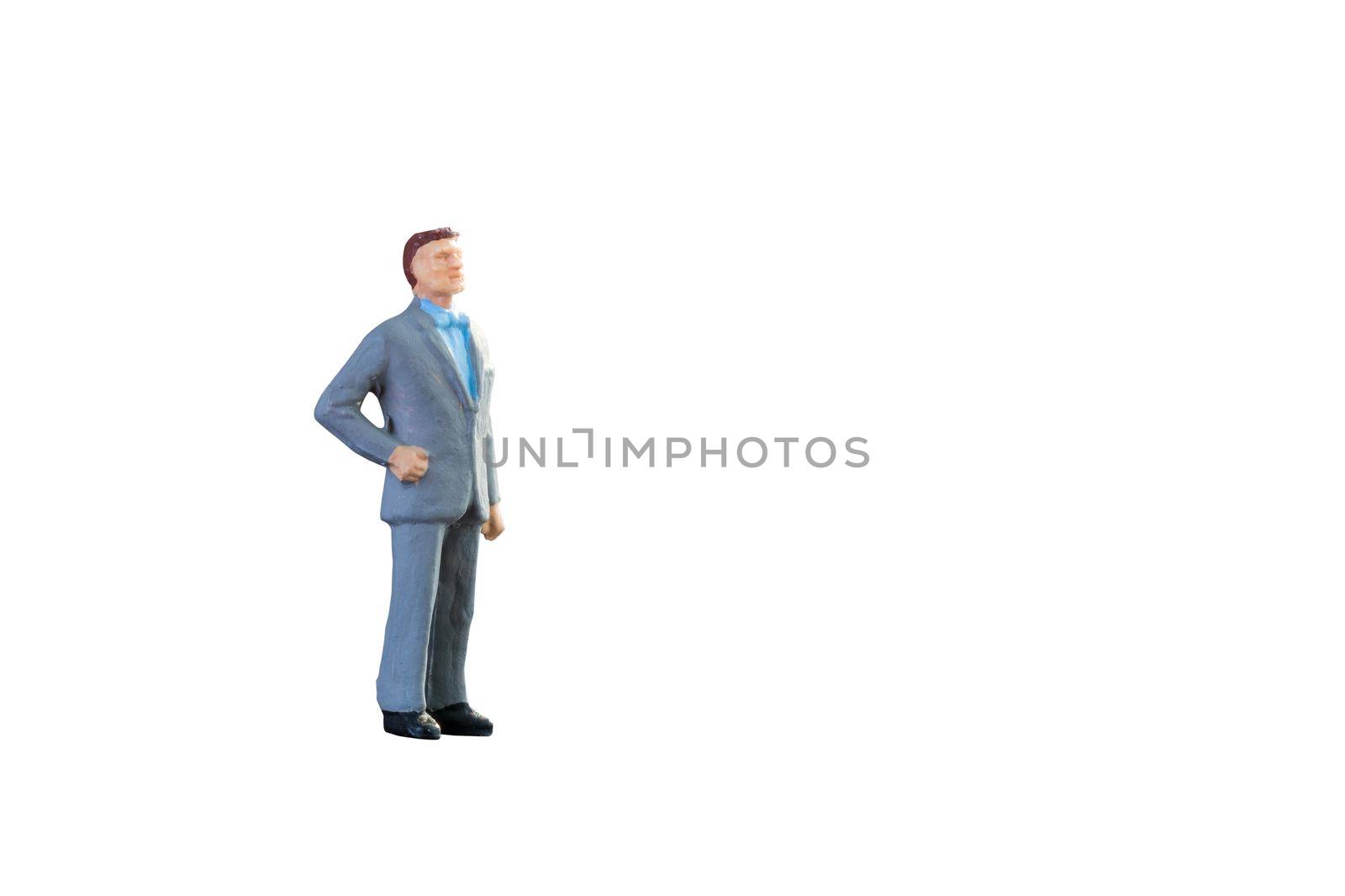Close up of Miniature businessman and tourist people isolated with clipping path on white background.Elegant Design with copy space for placement your text, mock up for business and travel concept. by Nuamfolio