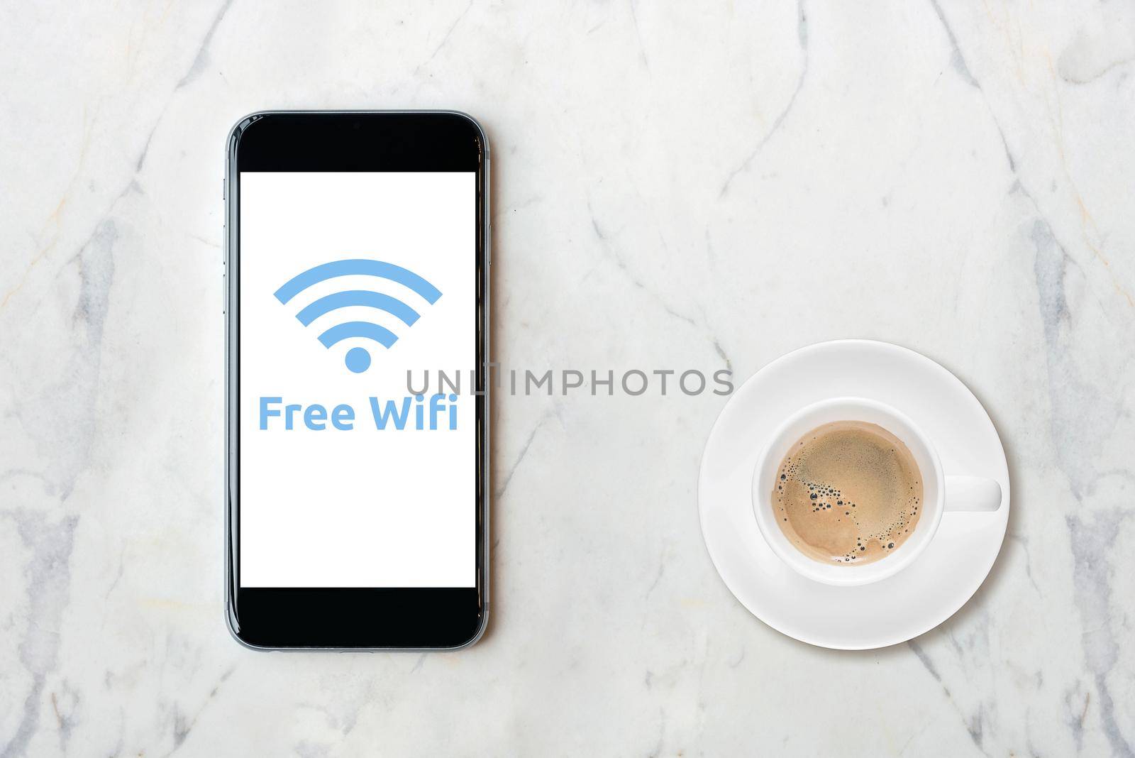 Smartphone with wifi network on screen and coffee cup on marble table.Elegant Design for smart business, business idea and internet of things technology concept 
