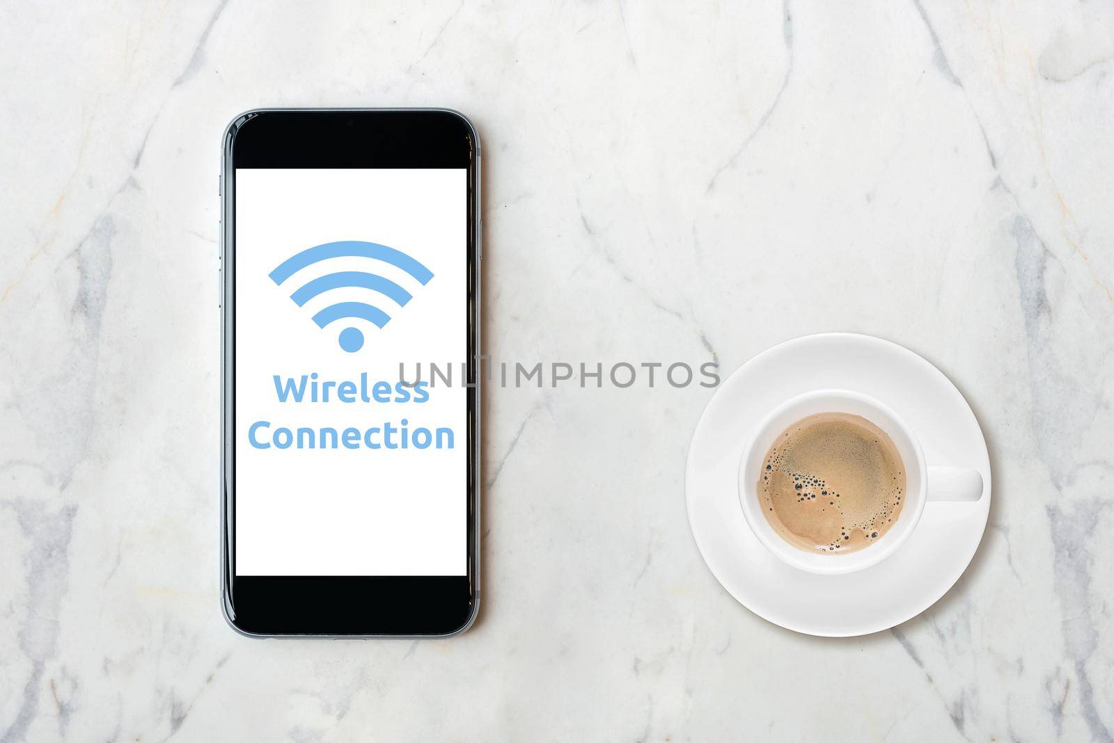 Smartphone with wifi network on screen and coffee cup on marble table.Elegant Design for smart business, business idea and internet of things technology concept  by Nuamfolio