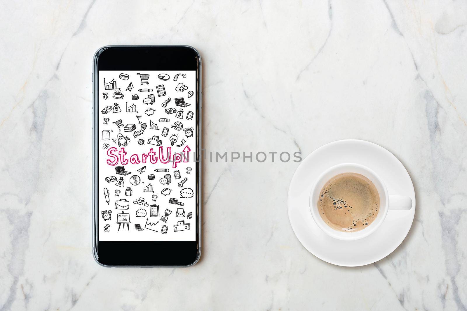 Smartphone with startup idea concept on screen with coffee cup on marble table. Elegant Design for business idea,startup business and business innovation technology. by Nuamfolio