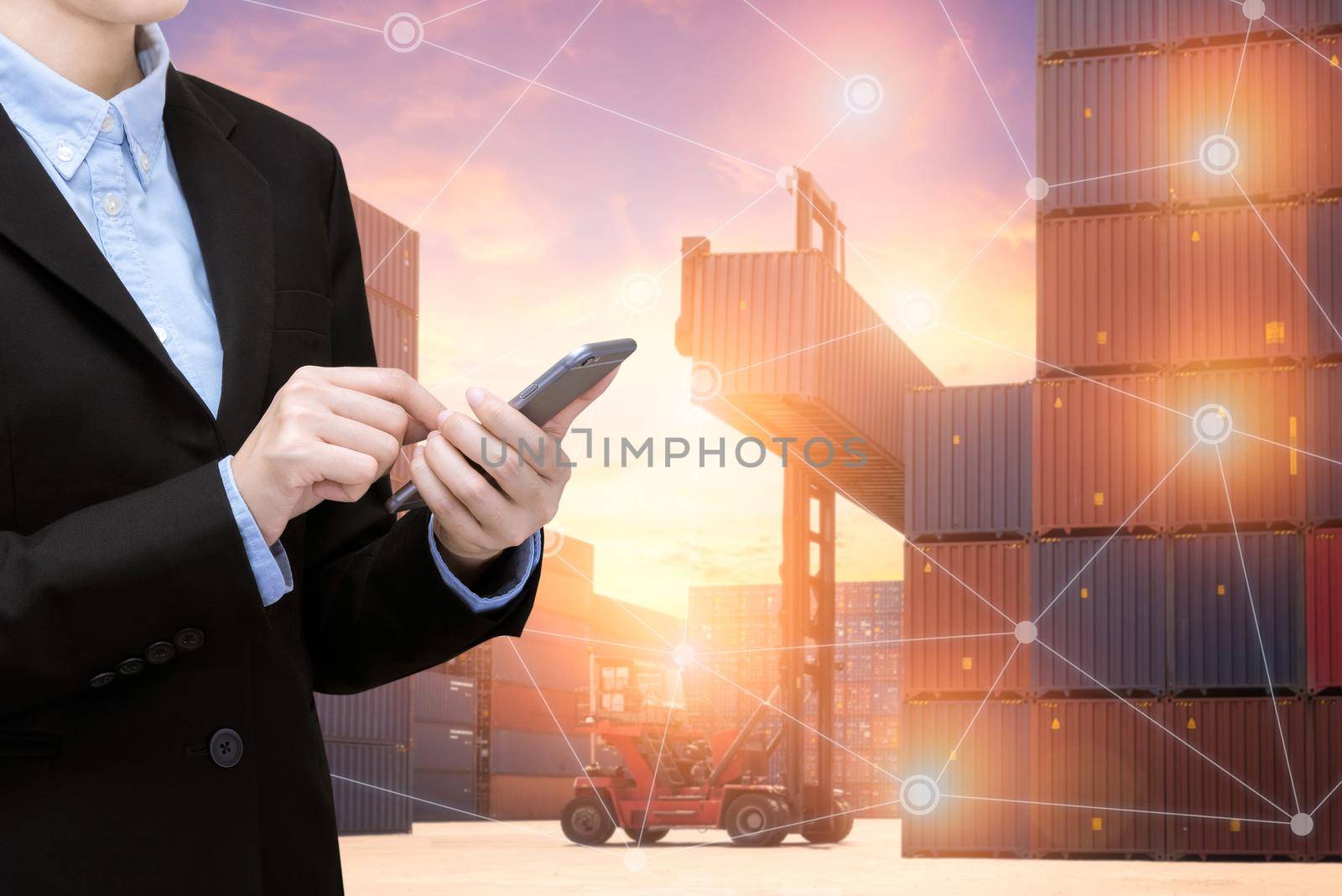 Smart Business woman use smartphone and internet of things technology for Global business connection with global customer for worldwide container cargo shipping.Logistic Import Export business concept