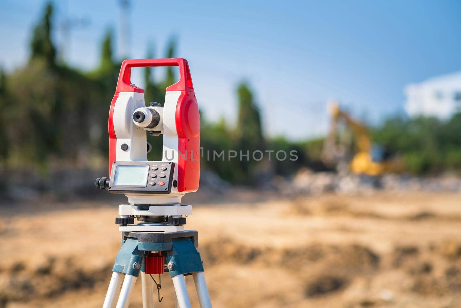 Surveyor equipment tacheometer or theodolite outdoors at construction site for civil engineer checking the construction area  by Nuamfolio