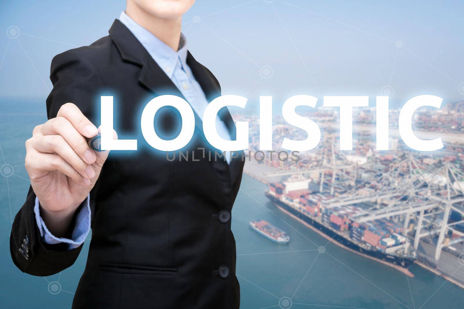 Smart Business woman is writing logistic concept with shipping boat at shipping yard in background for Global business container cargo shipping,Logistic,Import  and Export business concept by Nuamfolio