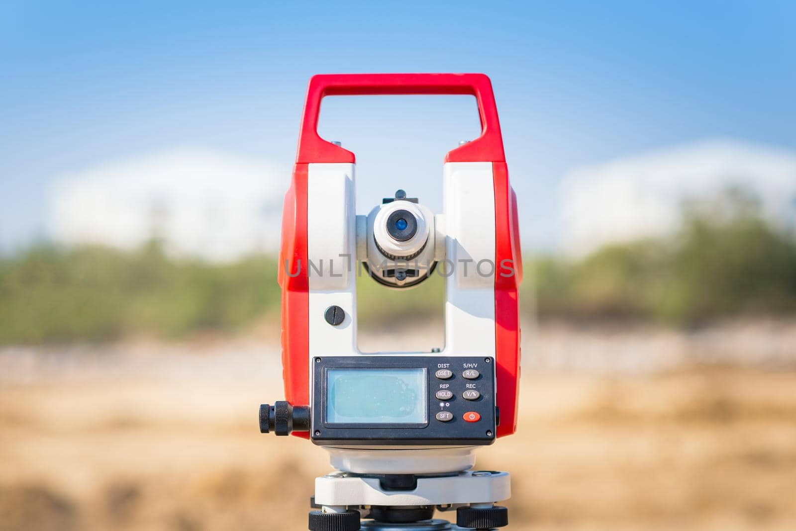 Surveyor equipment tacheometer or theodolite outdoors at construction site for civil engineer checking the construction area  by Nuamfolio