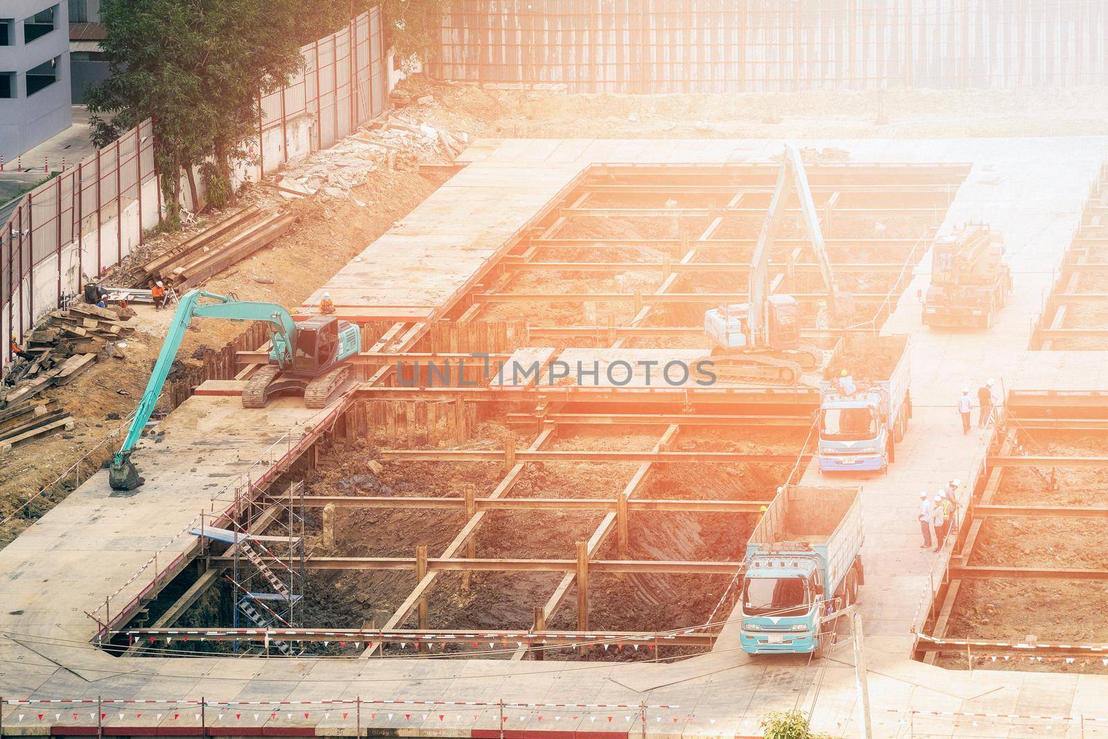 Construction engineer and foreman worker woking at construction site for new building construction project