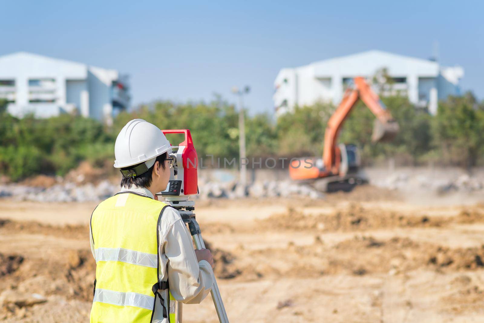 Construction engineer use surveyor equipment checking construction site for new Infrastructure construction project