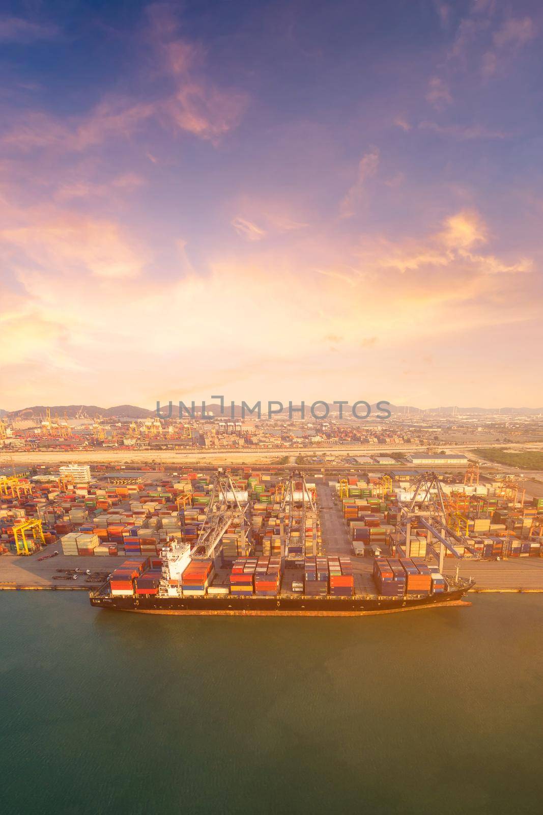 Large container shipping boat at shipping yard main transportation of cargo container shipping. Photo concept for Global business containers shipping,Logistic,Import and Export industry