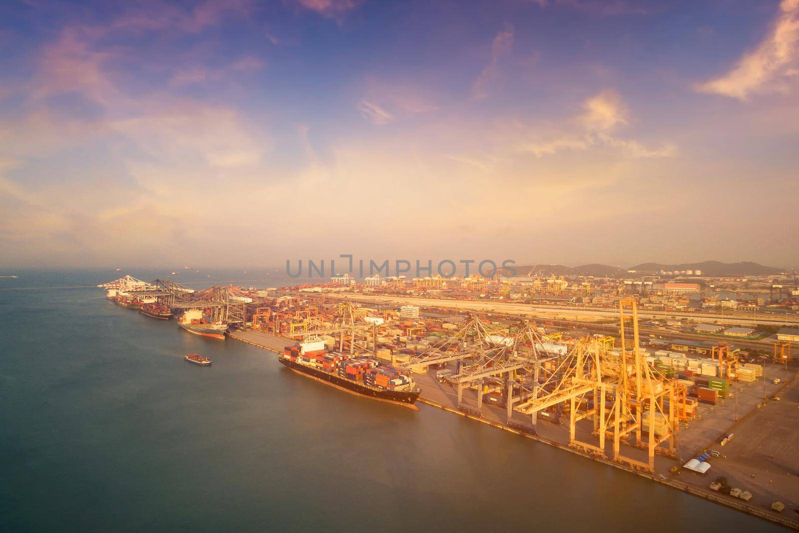 Large container shipping boat at shipping yard main transportation of cargo container shipping. Photo concept for Global business containers shipping,Logistic,Import and Export industry