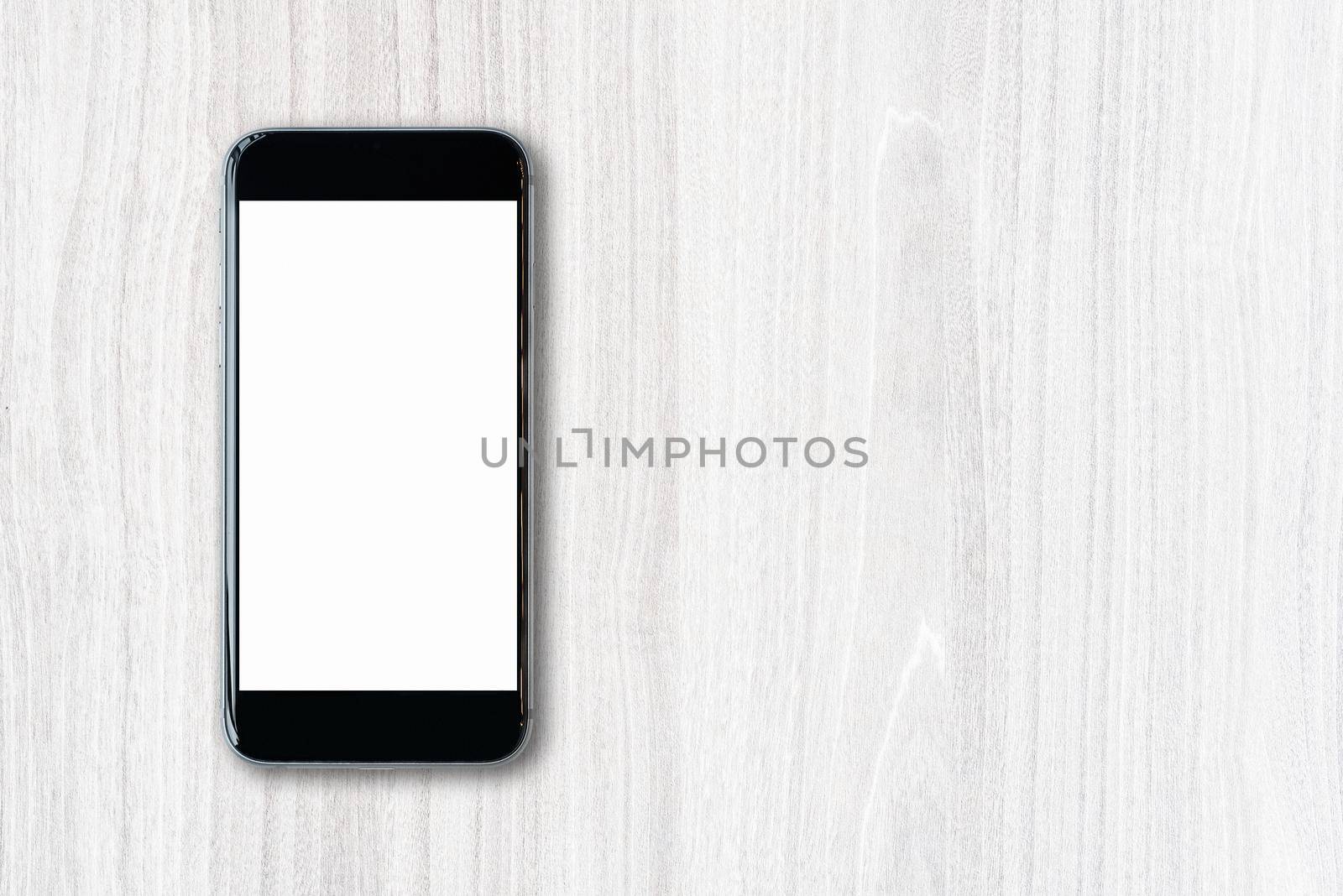 Flat lay Smartphone with blank white screen and copy-space on wood table. by Nuamfolio