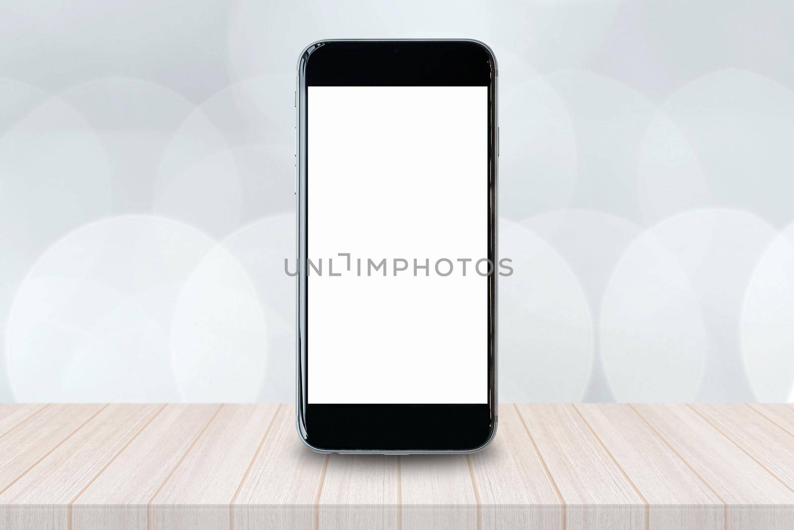 Smartphone with blank white screen and copy-space on wood table. by Nuamfolio