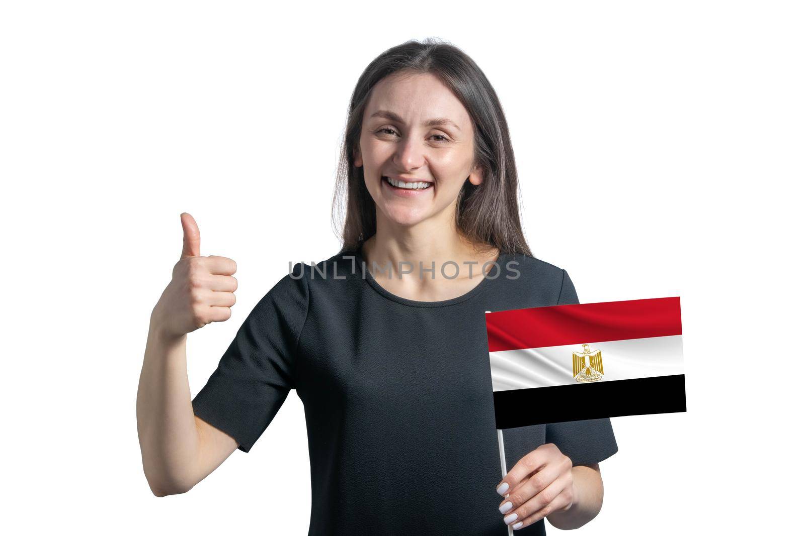 Happy young white woman holding flag of Egypt and shows the class by hand isolated on a white background by uspmen