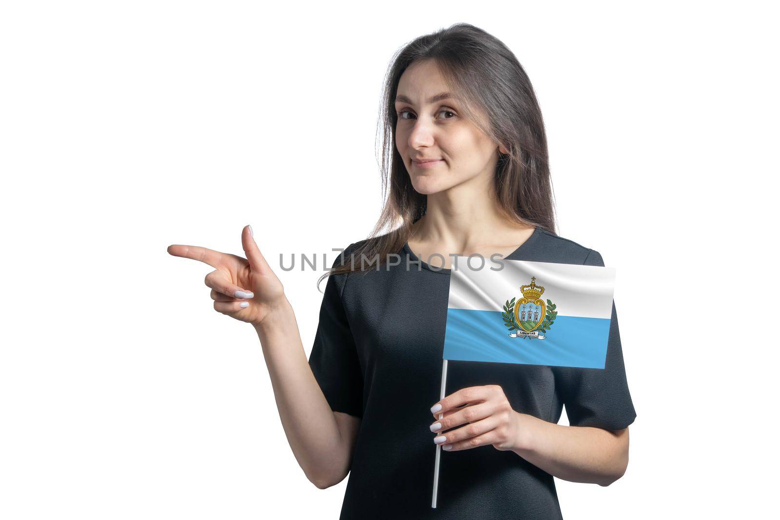 Happy young white woman holding flag San Marino and points to the left isolated on a white background by uspmen