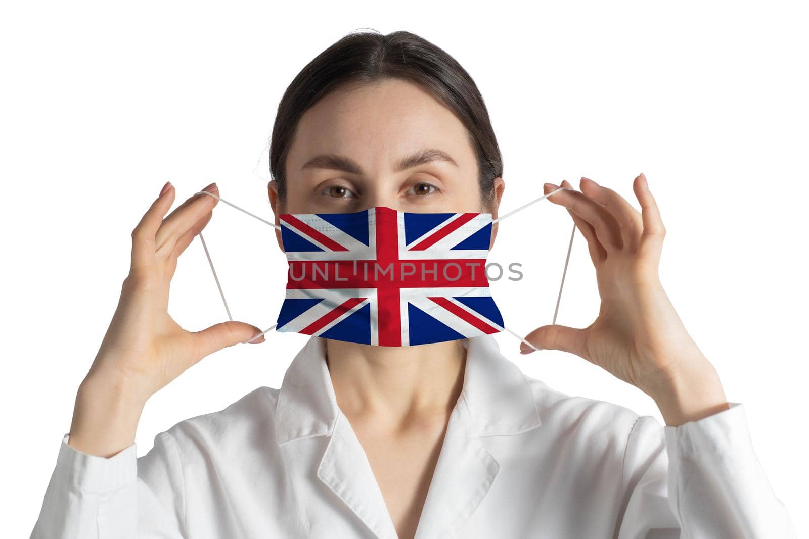 Respirator with flag of United Kingdom Doctor puts on medical face mask isolated on white background.