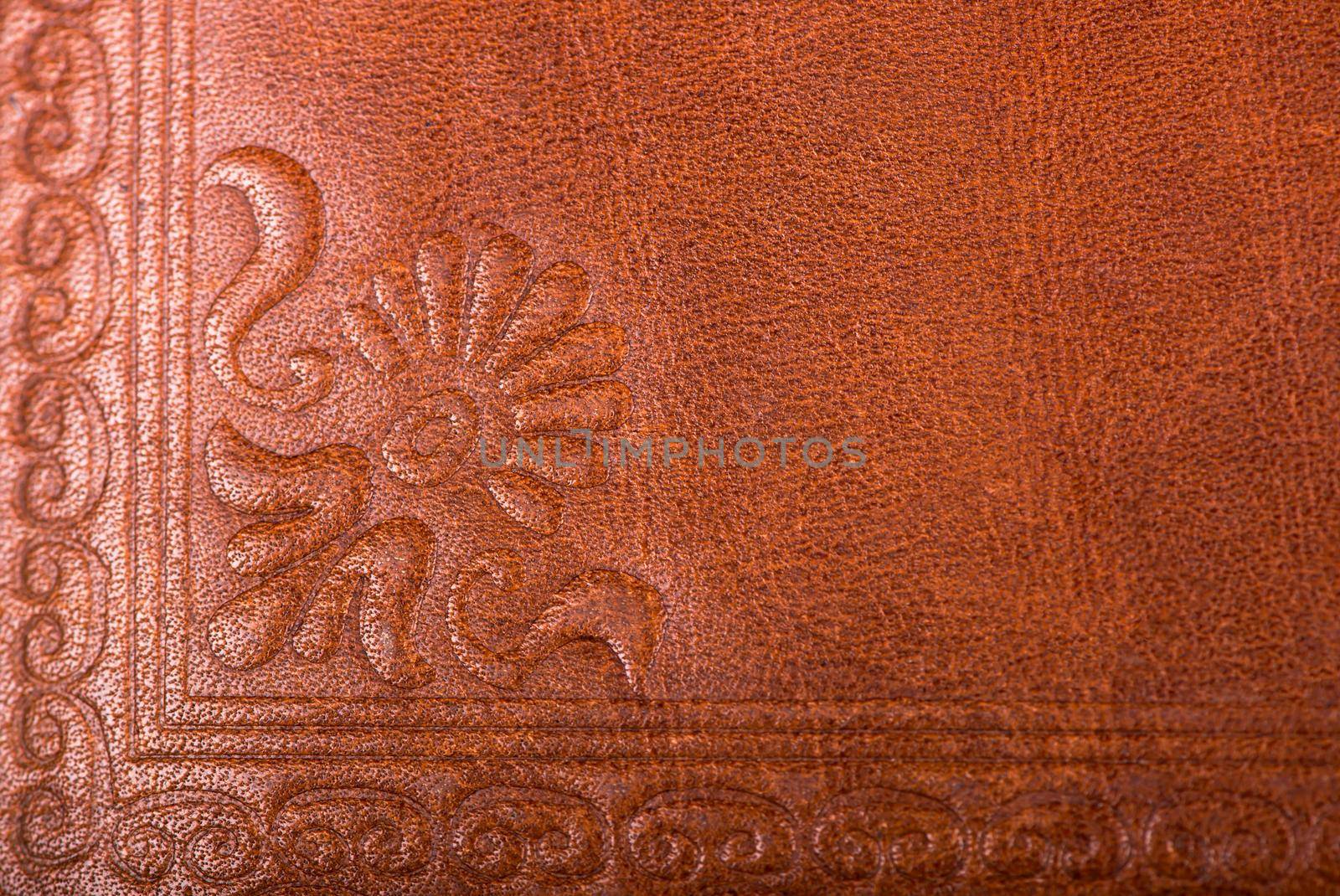 Leather floral pattern deep red color background by aprilphoto