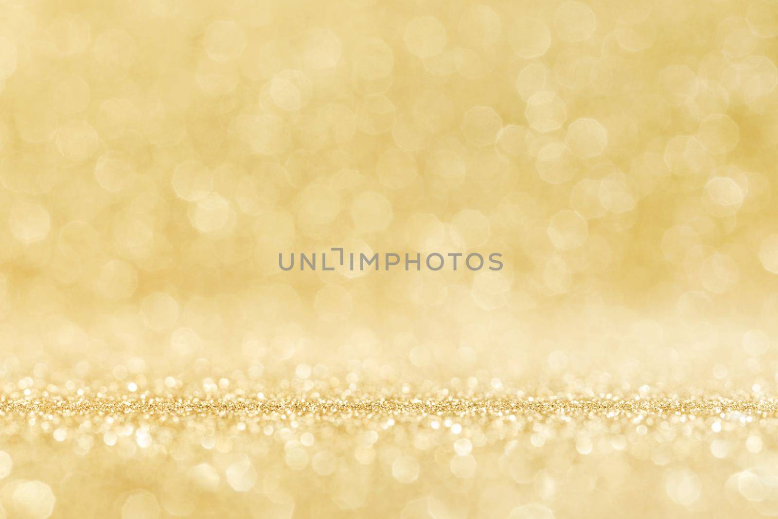 Shiny golden bokeh glitter lights abstract background, Christmas New Year party celebration concept