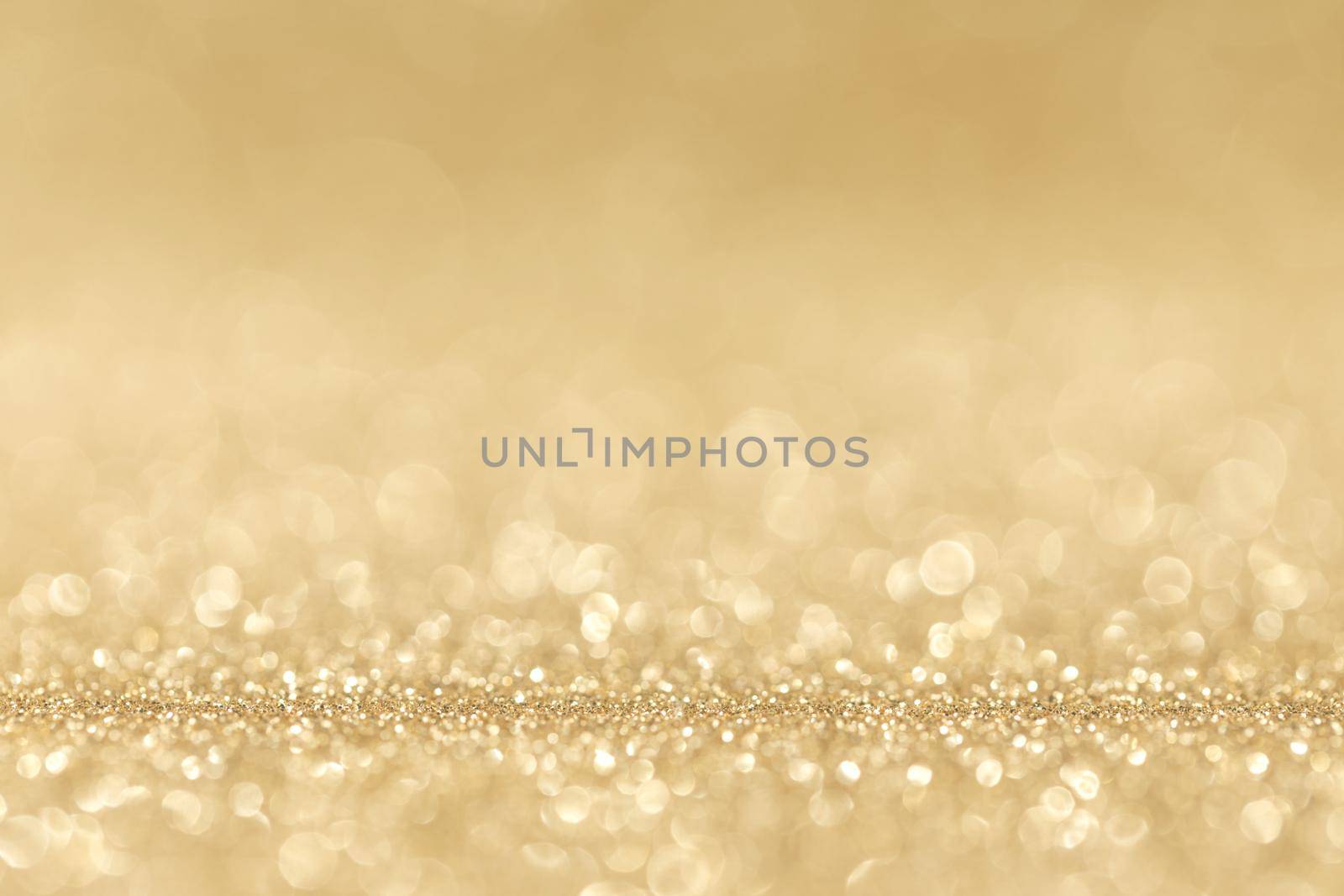 Shiny golden bokeh glitter lights abstract background, Christmas New Year party celebration concept