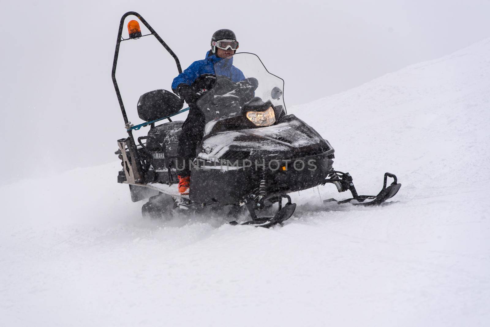 Grandvalira, Andorra: 2021 January 03: Ski Patrol in snowmobile in the Pyrenees at the Grandvalira ski resort in Andorra in Covid19 time