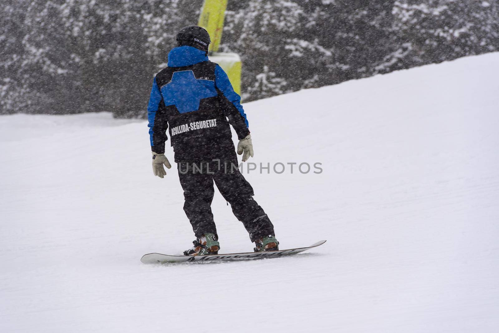 Grandvalira, Andorra: 2021 January 03: Ski Patrol skiing in the Pyrenees at the Grandvalira ski resort in Andorra in Covid19 time