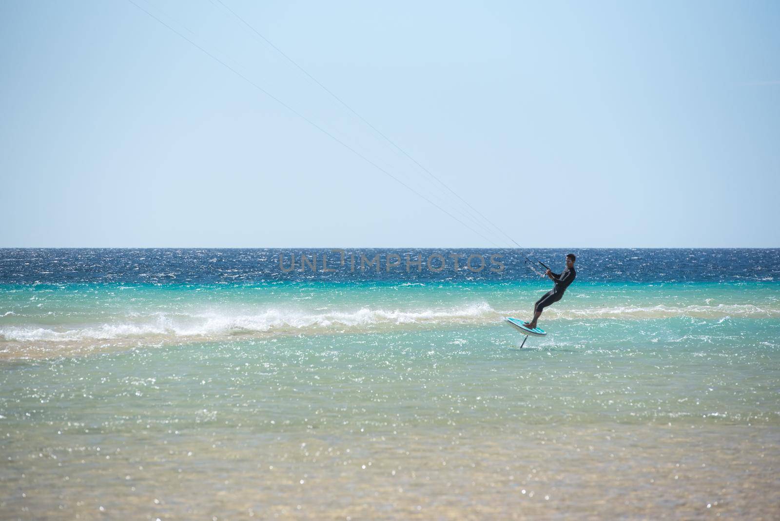 Fuerteventura, Spain : 2020 October 2 : Men in the pratic FOILBOARD in the Sotovento on Fuerteventura in summer 2020.