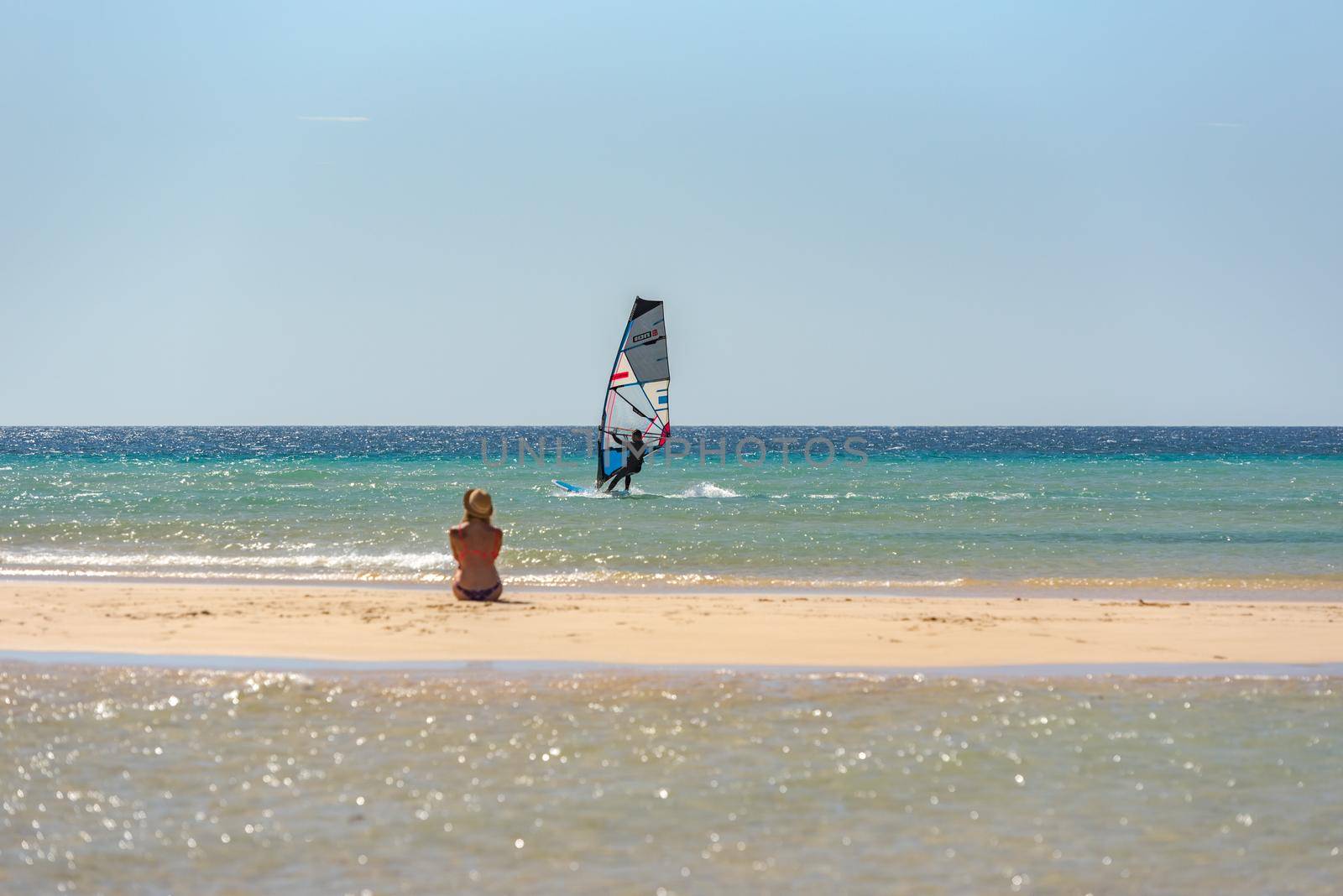 Sotavento, Fuerteventura, Spain: 2020 October 8: Man learning Windsurfing at Playa de Sotavento, Fuerteventura in Spain in summer.
