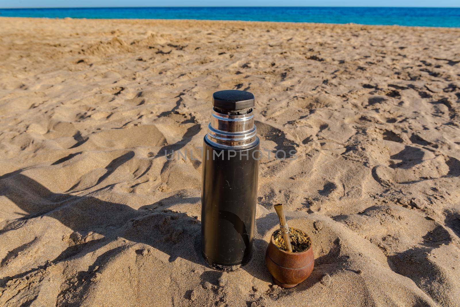 The Mate drink from Uruguay, Argentina, Paraguay and Brazil. Modern mate colour brown in the beach.