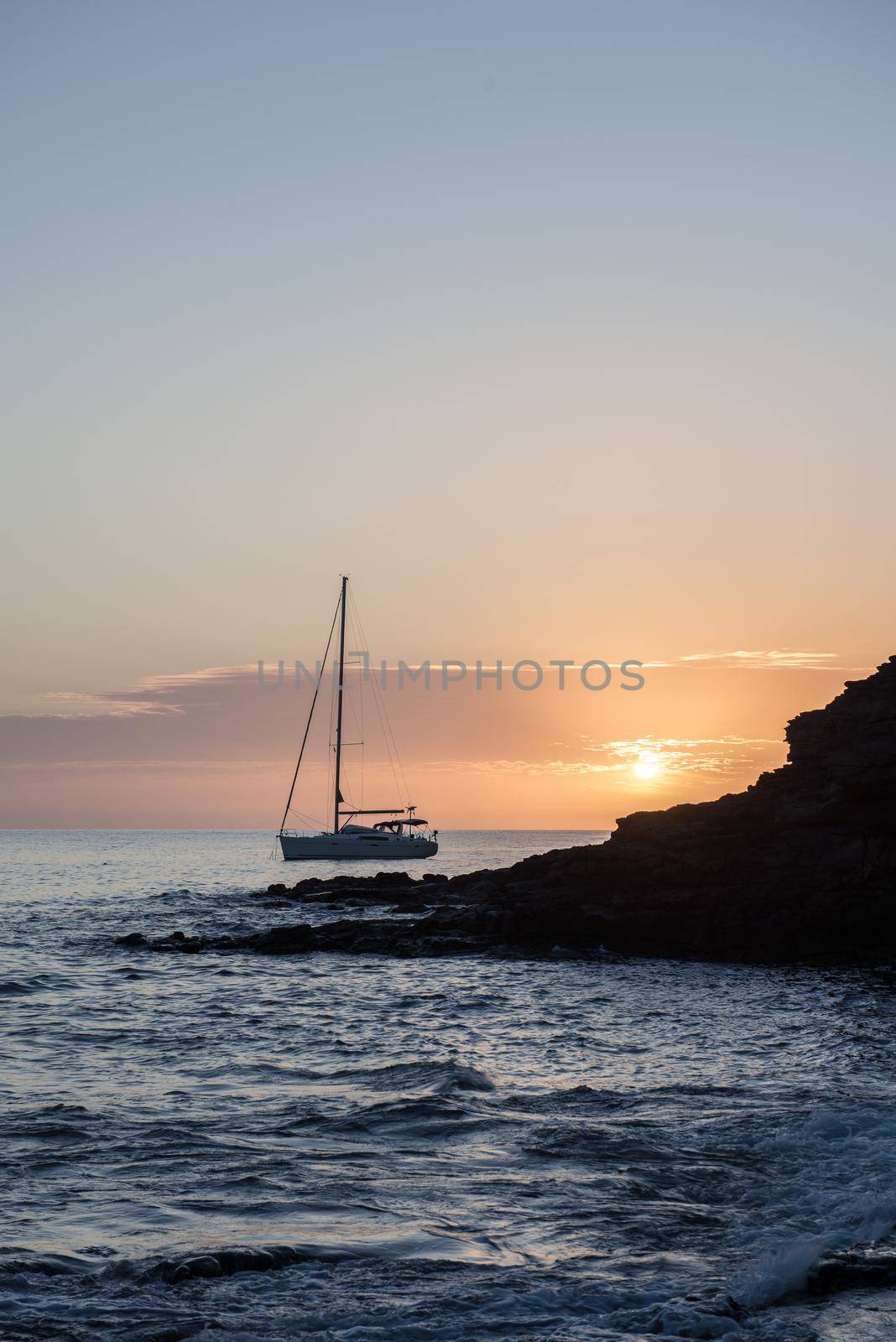 Boat at sunset in the Atlantic Sea on the Island of Fuerteventura in Spain.