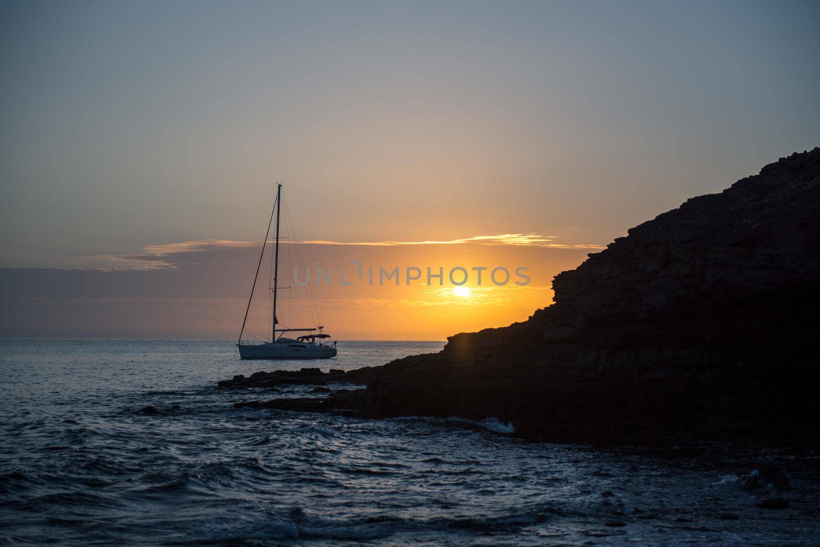 Boat at sunset in the Atlantic Sea on the Island of Fuerteventura in Spain.
