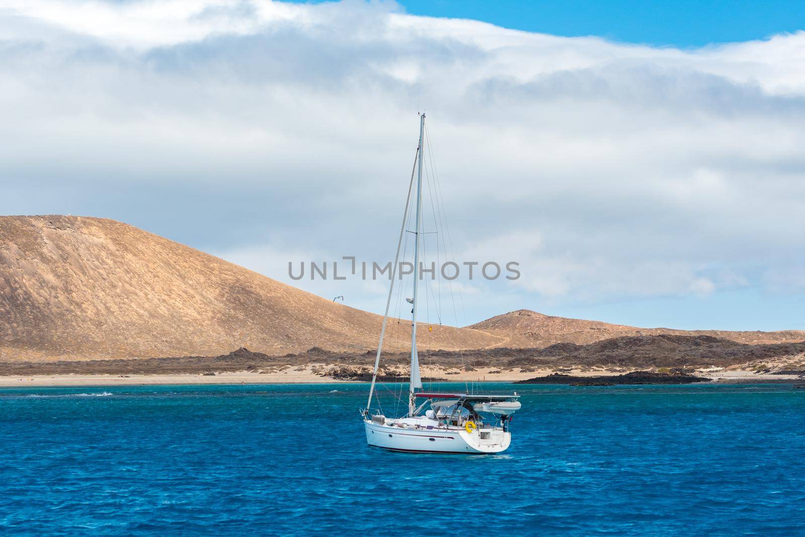 Corralejo, Fuerteventura, Spain: 2020 September 30: Boat in the sea near Corralejo in Fuerteventura in the Canary Islands in Spain.