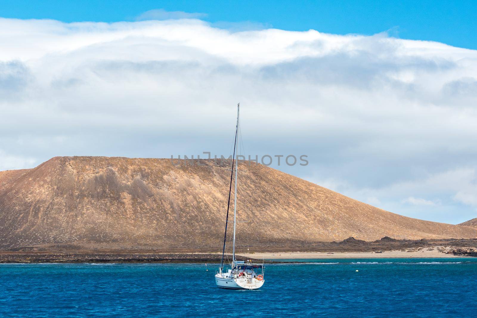 Corralejo, Fuerteventura, Spain: 2020 September 30: Boat in the sea near Corralejo in Fuerteventura in the Canary Islands in Spain.