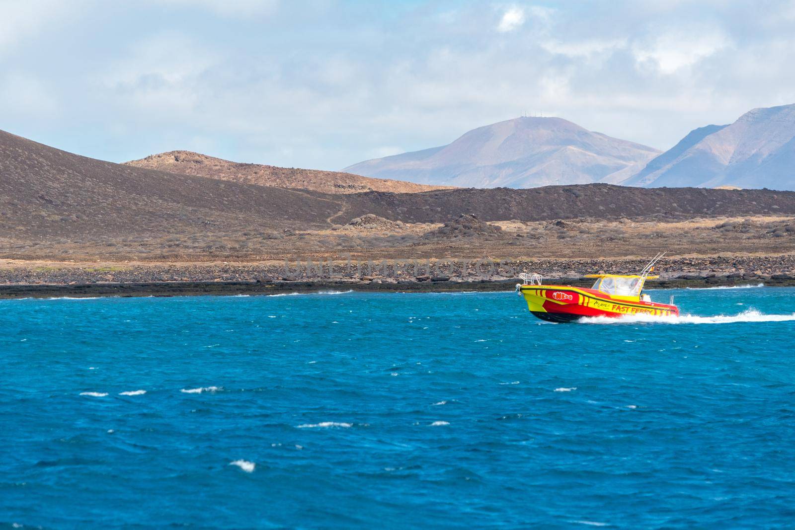 Corralejo, Fuerteventura, Spain: 2020 September 30: Fast Ferry in the port of Corralejo in Fuerteventura in the Canary Islands in Spain.