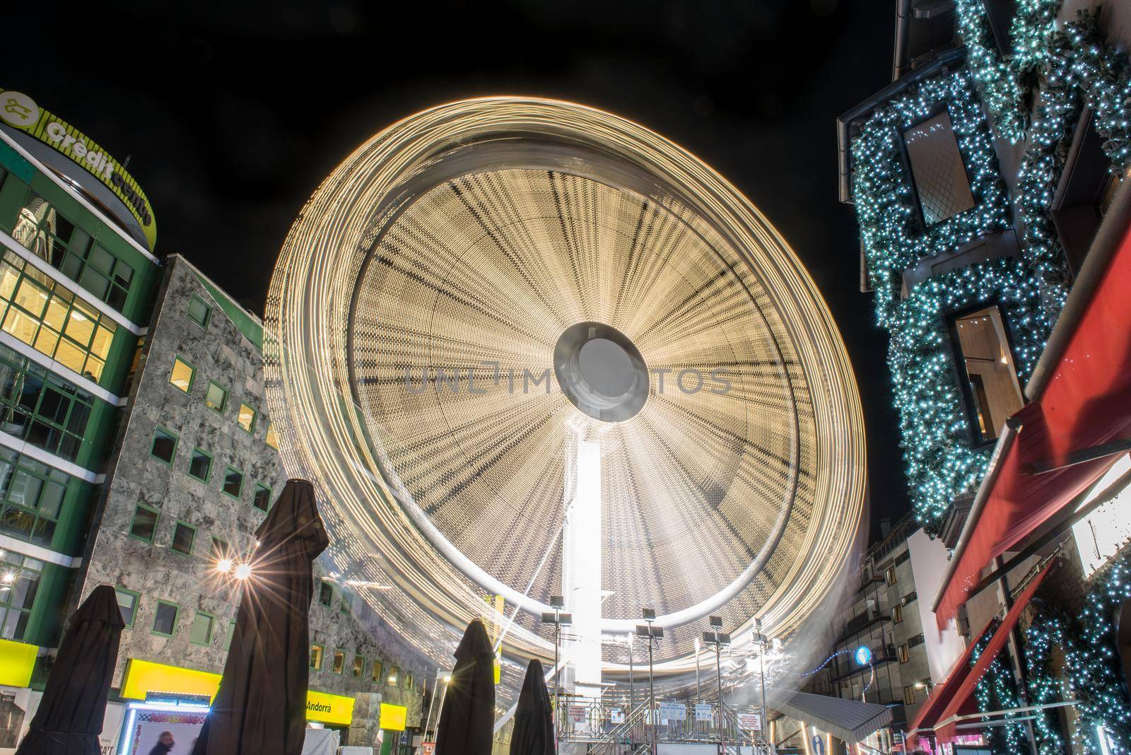 Andorra la Vella, Andorra : 2020 October 30 : Ferris wheel in the City of Andorra La Vella, capital of Andorra in the Pyrenees in autumn 2020.