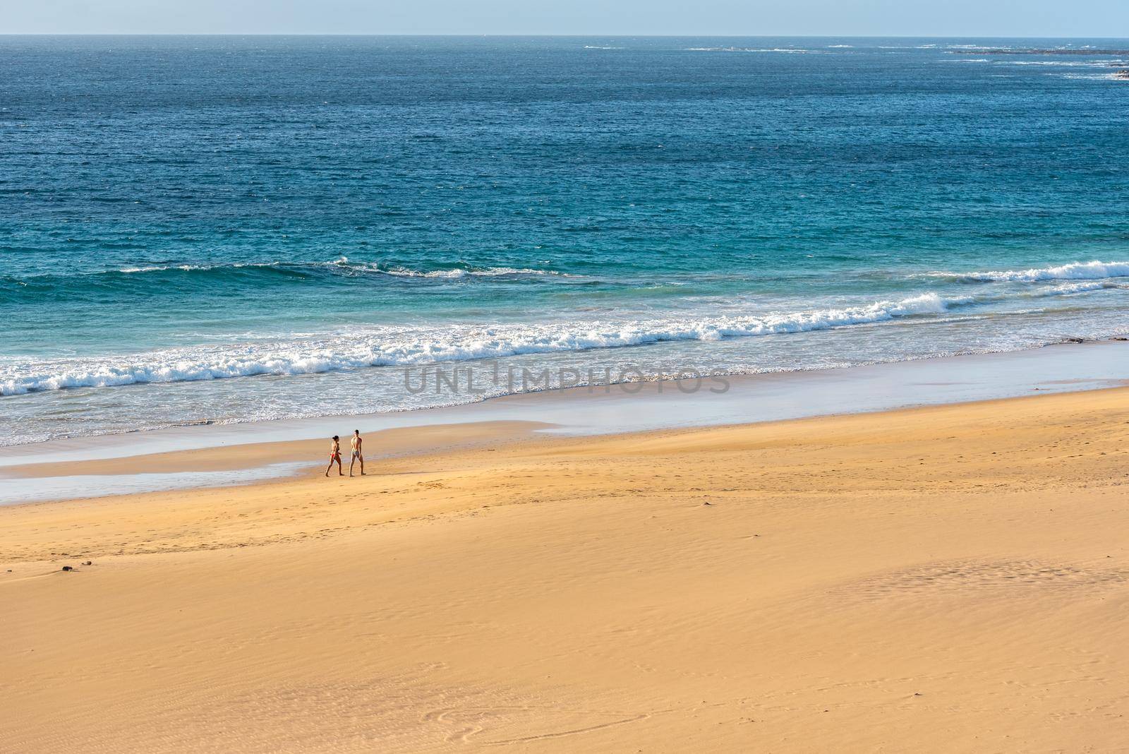 El Cotillo, Fuerteventura, Spain : 2020 October 1 :  Couple walk in the Coast in Fuerteventura at El Cotillo in the Canary Islands, Spain in summer 2020.