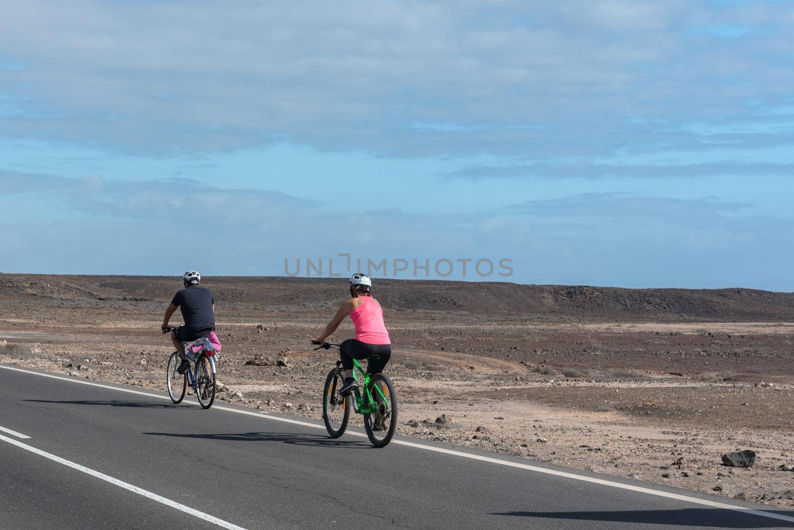 Corralejo, Fuerteventura, Spain: 2020 September 30: People in bike in  the Parque Natual Dunas de Corralejo on Fuerteventura on the Canary Islands in Spain.