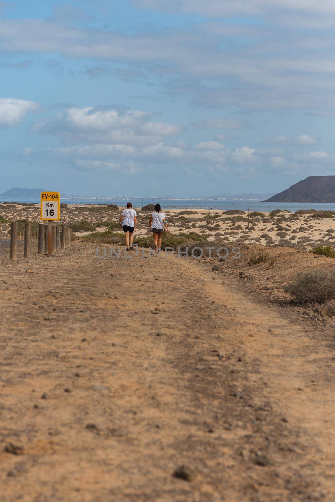 Corralejo, Fuerteventura, Spain: 2020 October 30: People walk  in the Dunas de Corralejo Natural Park in Fuerteventura, Spain in the fall of 2020.
