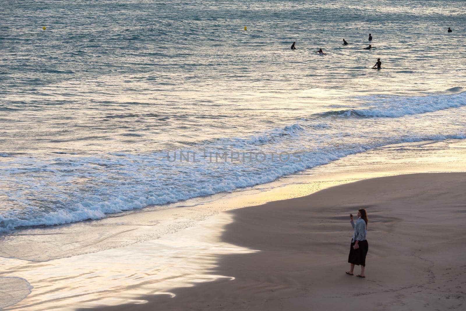 Tarragona, Spain: September 27, 2020: Woman take a picture in the Plaza del Anfiteatro in Tarragona in the summer of 2020.
