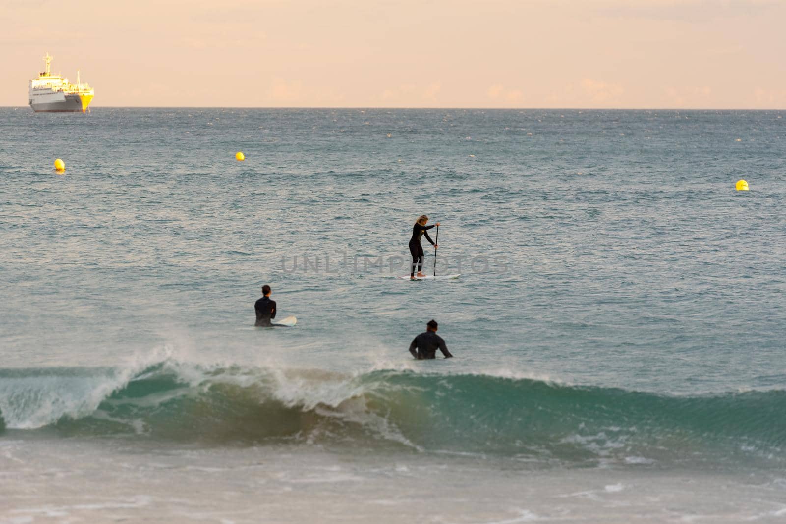 Tarragona, Spain: September 27, 2020: People surfing in the Plaza del Anfiteatro in Tarragona in the summer of 2020.