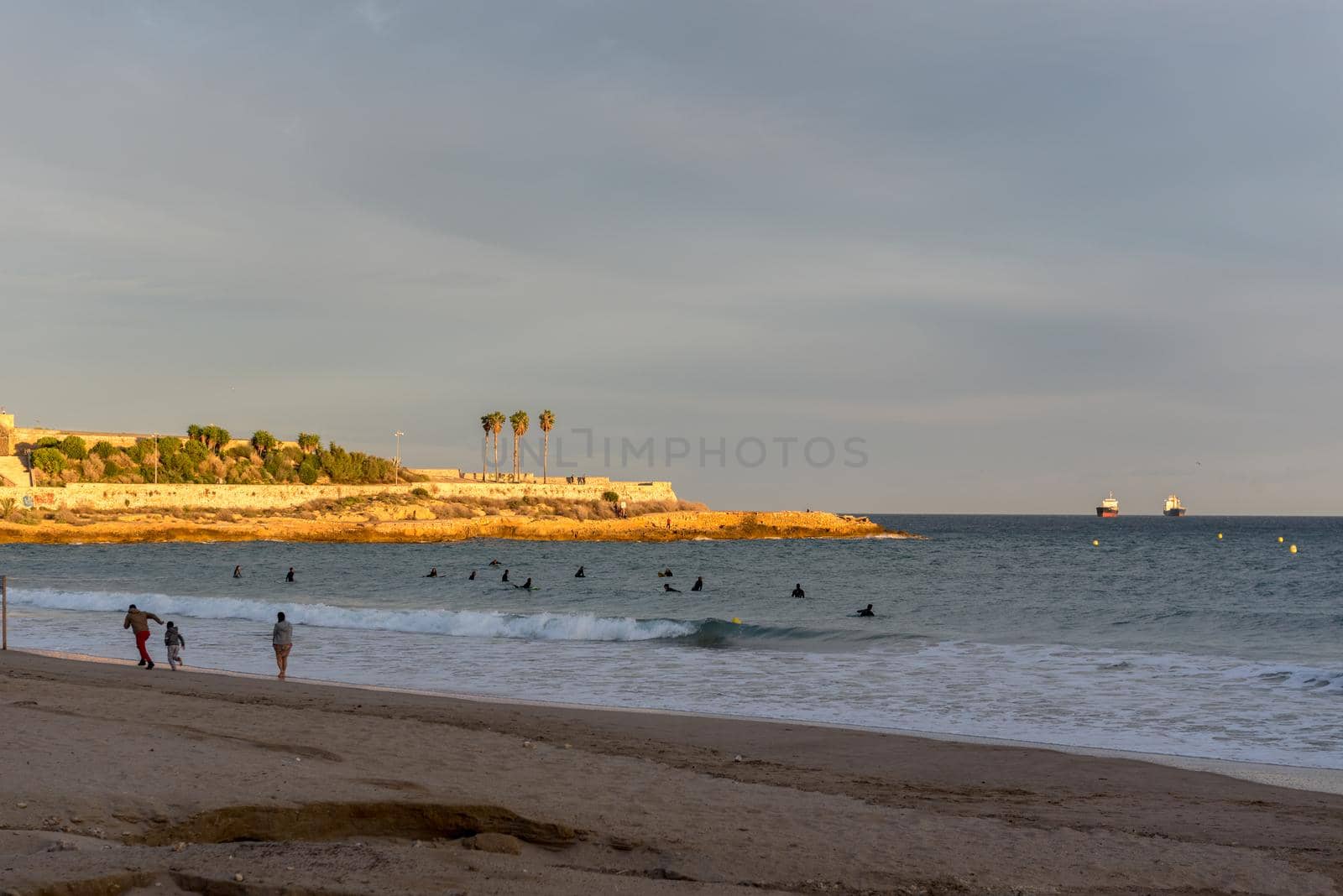 Tarragona, Spain: September 27, 2020: People surfing in the Plaza del Anfiteatro in Tarragona in the summer of 2020.