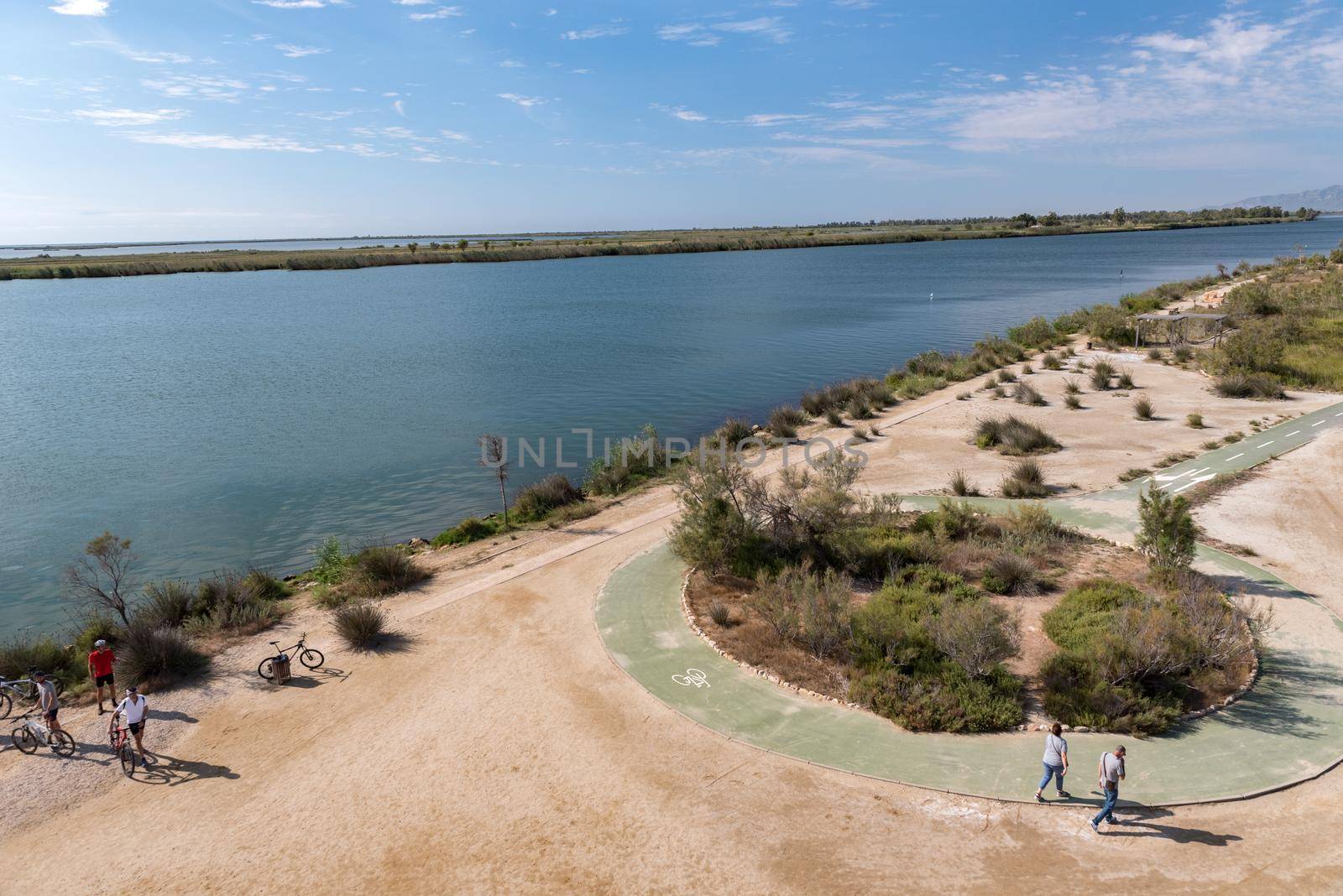 Ebro Delta, Spain: 2020 September: People in bike in the Ebro River in summer in the port.